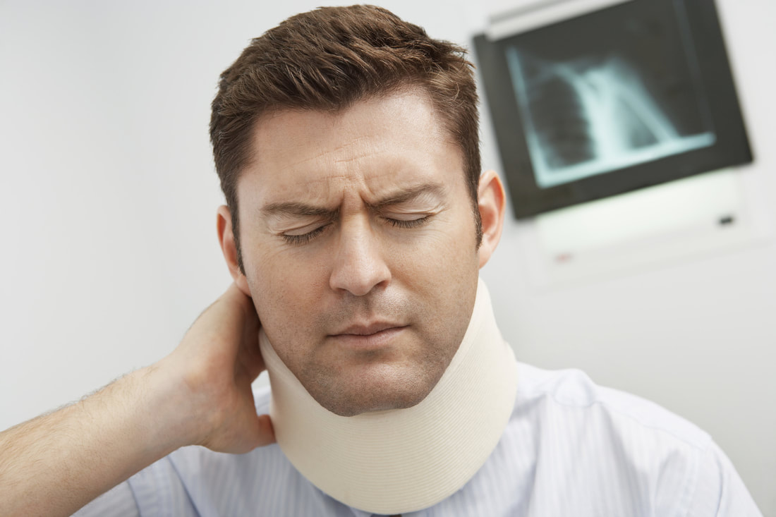 man with neck support